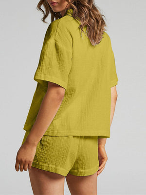 a woman wearing a yellow shirt and shorts