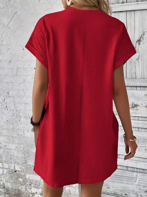 a woman wearing a red shirt dress