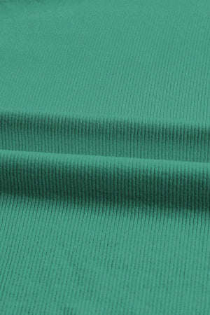 a close up view of a green fabric