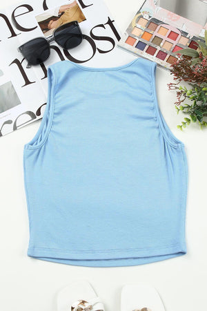 a pair of sandals and a blue tank top