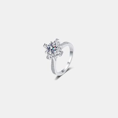 a white gold ring with a single diamond