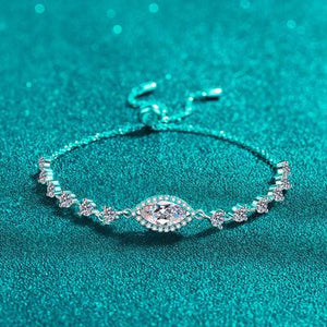 a diamond bracelet on a turquoise background