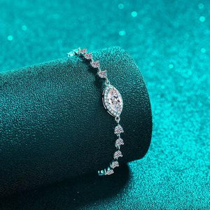 a close up of a diamond bracelet on a velvet roll