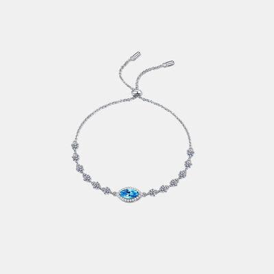 a bracelet with a blue stone on a white background