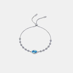 a bracelet with a blue stone on a white background