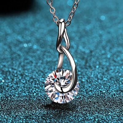a necklace with a diamond on a blue background