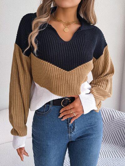 a woman wearing a sweater and jeans