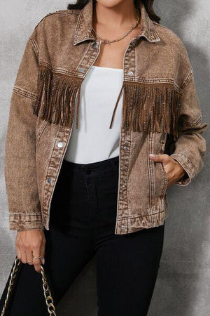 a woman wearing a brown jacket and black pants