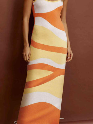 a woman in an orange and white striped dress
