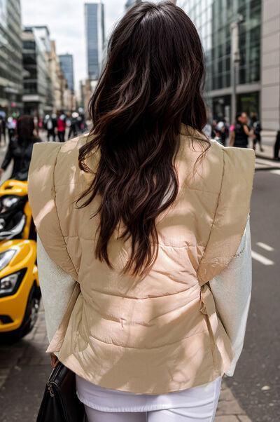 a woman walking down a street next to a yellow car