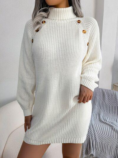 a woman wearing a white sweater dress