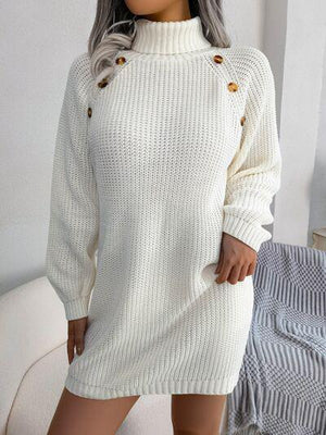 a woman wearing a white sweater dress