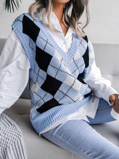 a woman sitting on a couch wearing a sweater