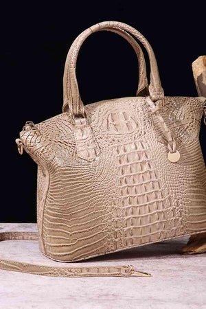 a handbag sitting on top of a table next to a banana