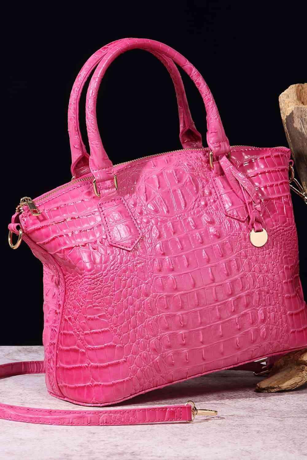 a pink purse sitting on top of a table