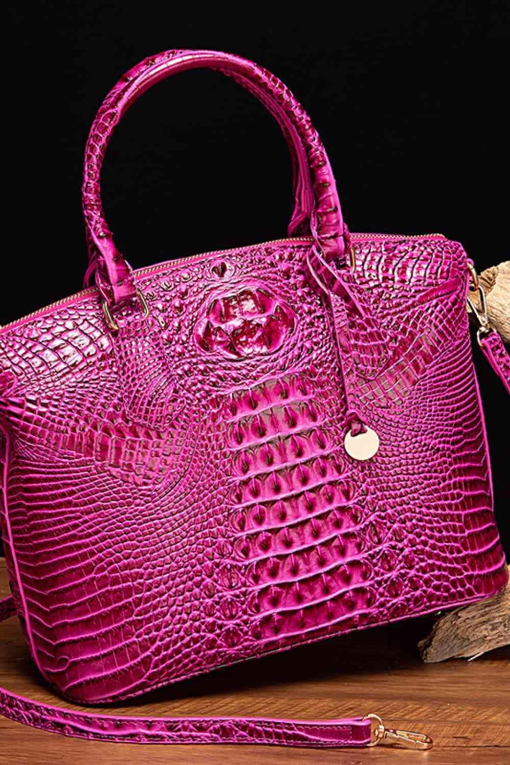 a pink purse sitting on top of a wooden table