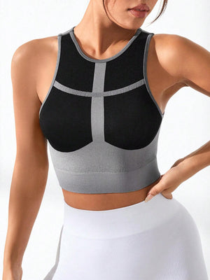 a woman wearing a black and grey sports bra