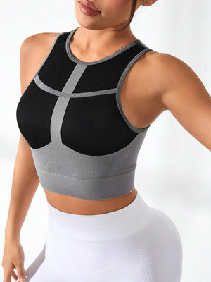 a woman wearing a black and grey sports bra
