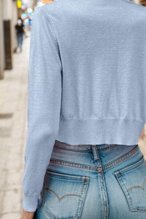 the back of a woman's jean shorts on a city street