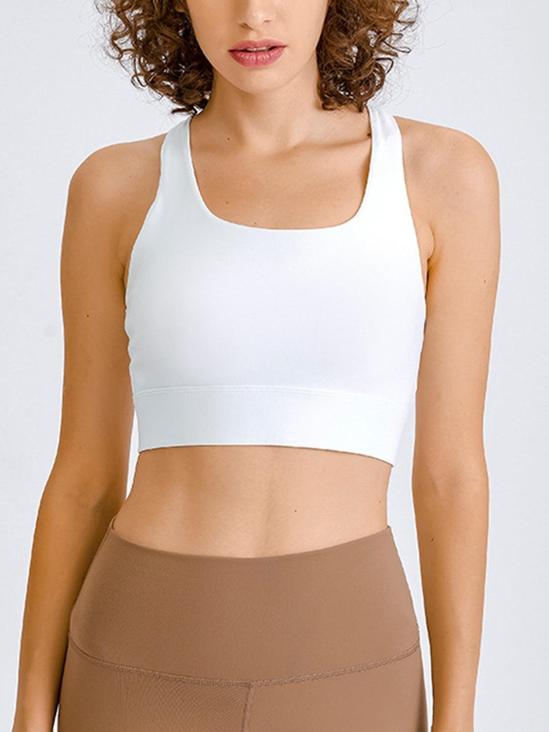 a woman in a white sports bra top
