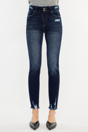 a woman in a gray sweater and jeans