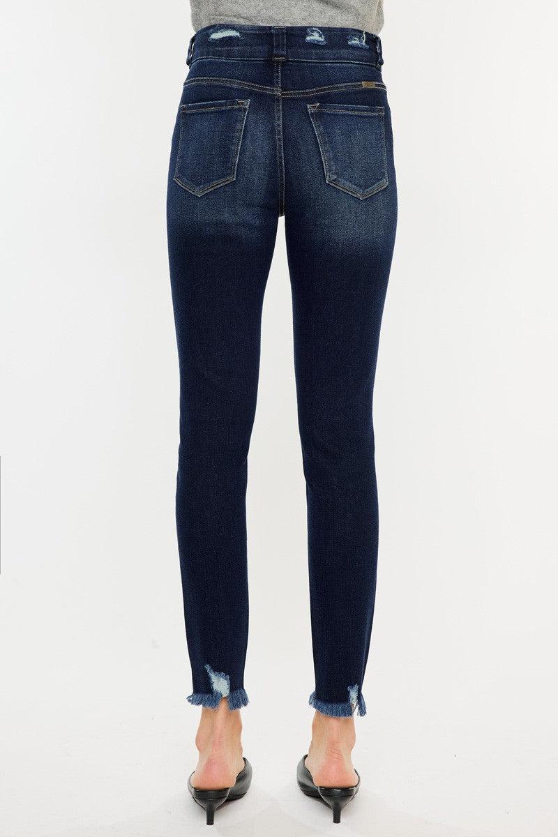 a woman in a gray sweater and jeans