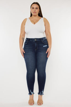 a woman in a white top and jeans