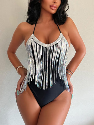 a woman in a black and white bathing suit