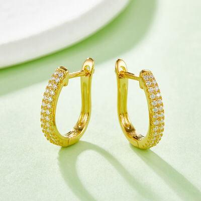 a pair of yellow gold hoop earrings with diamonds