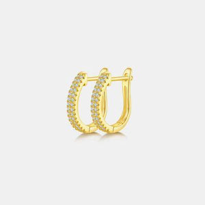 a pair of yellow gold hoop earrings with diamonds
