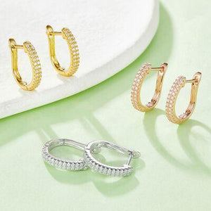 three pairs of gold and silver hoop earrings