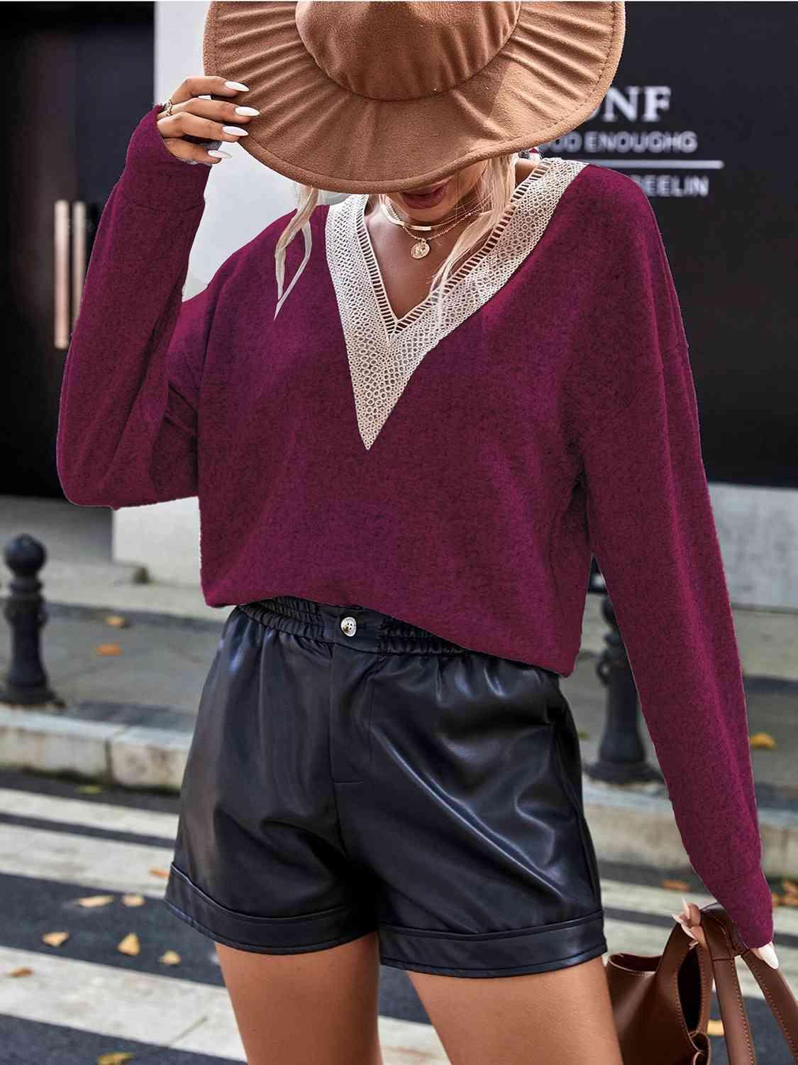 a woman wearing a brown hat and black shorts