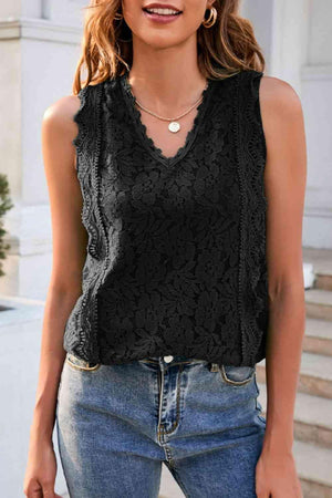 a woman wearing a black top and jeans
