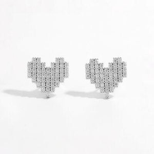 a pair of diamond earrings on a white background