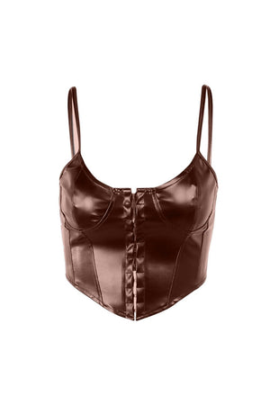 a woman wearing a brown leather top