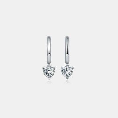 a pair of diamond earrings on a white background