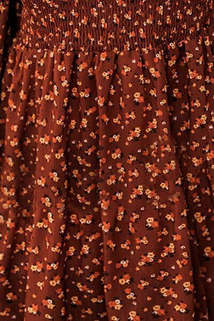 a close up of a dress with flowers on it