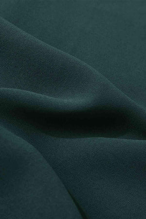 a close up of a dark green fabric