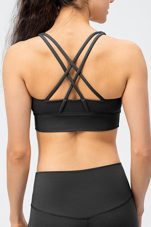 the back of a woman wearing a black sports bra