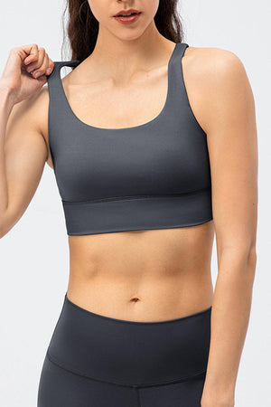 a woman in a gray sports bra top