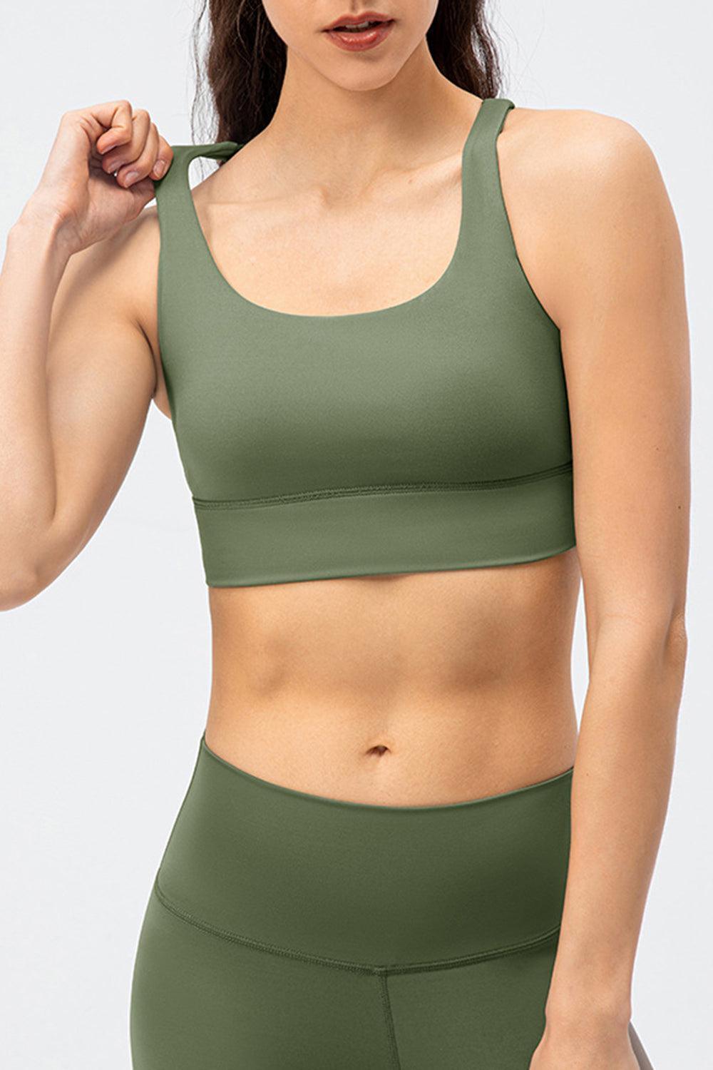 a woman in a green sports bra top