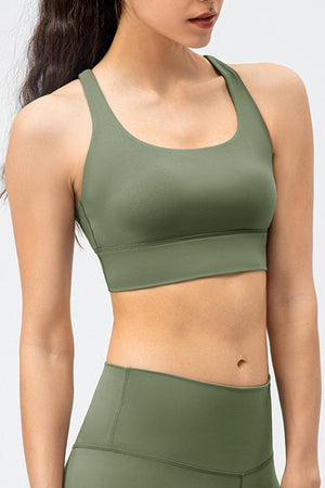 a woman wearing a green sports bra top