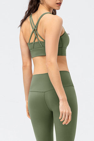 a woman in a green sports bra top and leggings