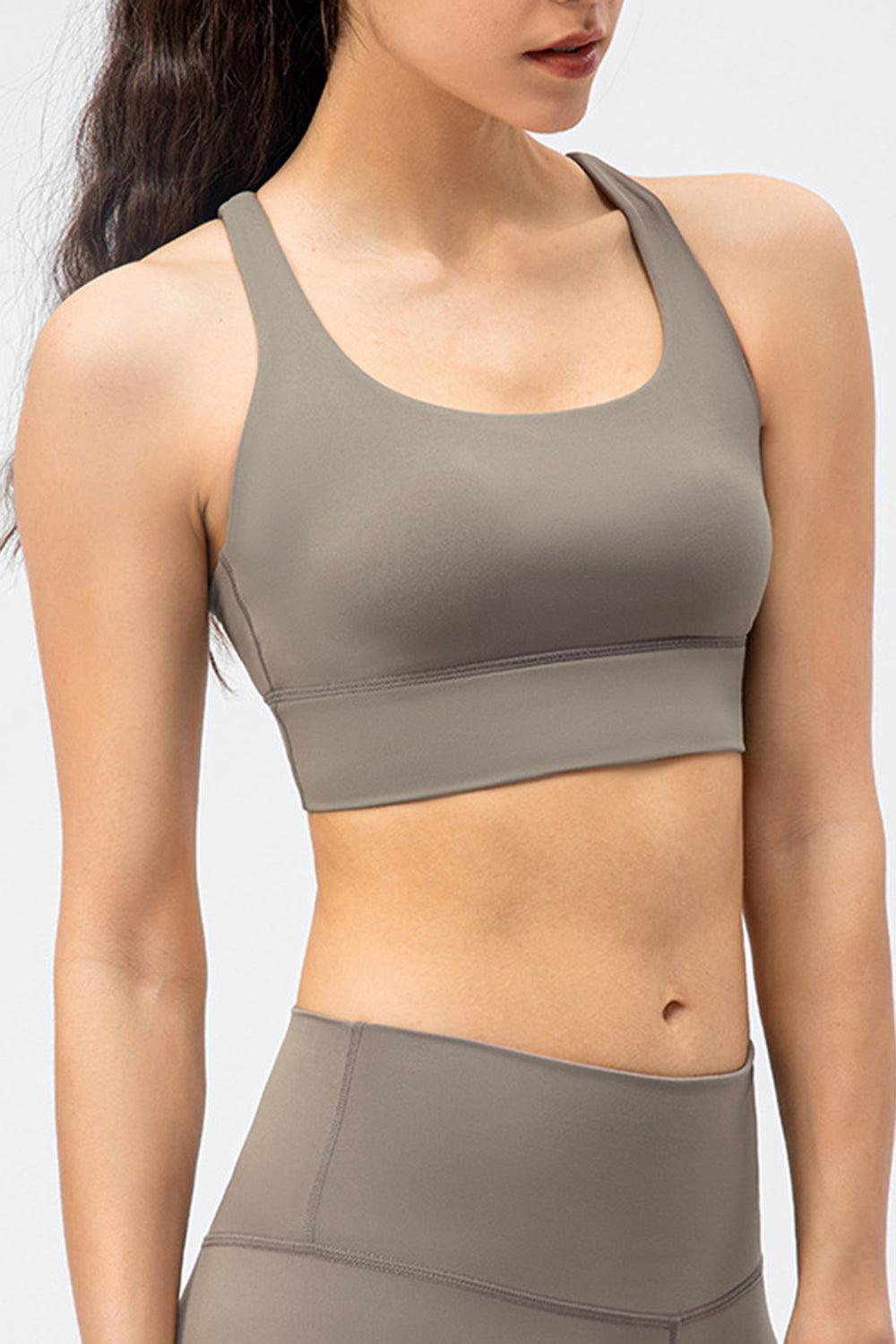 a woman wearing a gray sports bra top