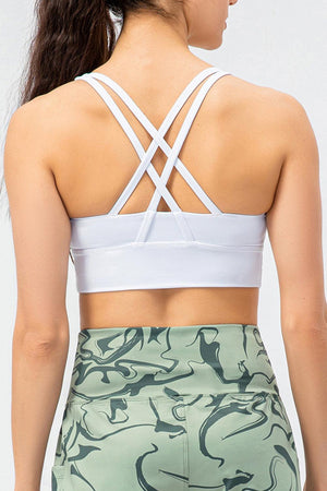 the back of a woman wearing a white sports bra top