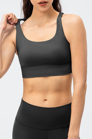 a woman wearing a black sports bra top