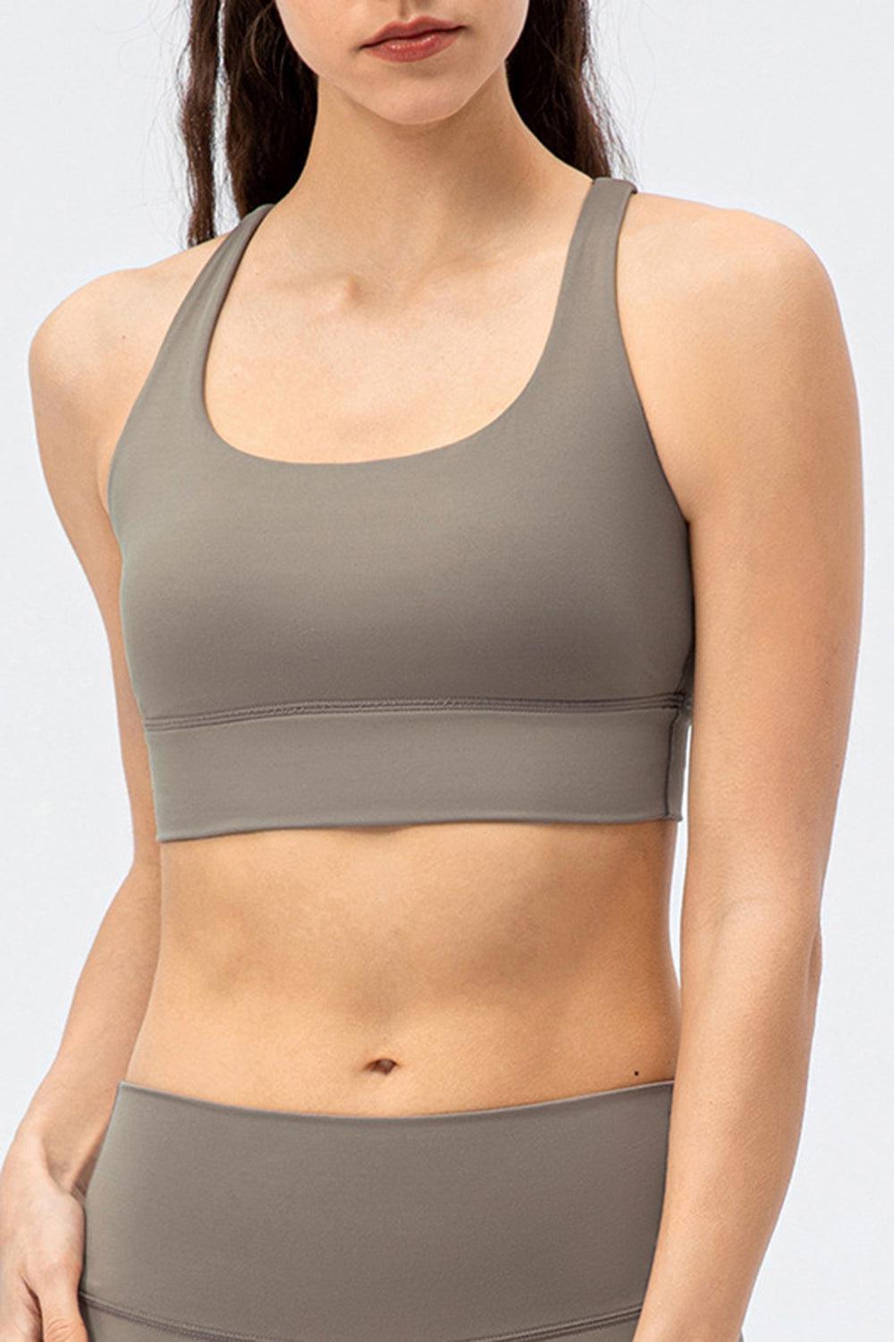 a woman in a gray sports bra top