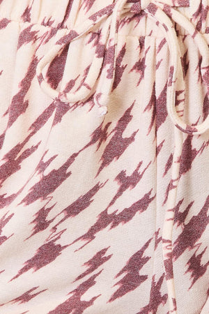 a close up of a person's pants with a tie
