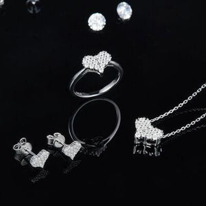 a collection of jewelry on a black background
