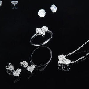 a collection of jewelry on a black background